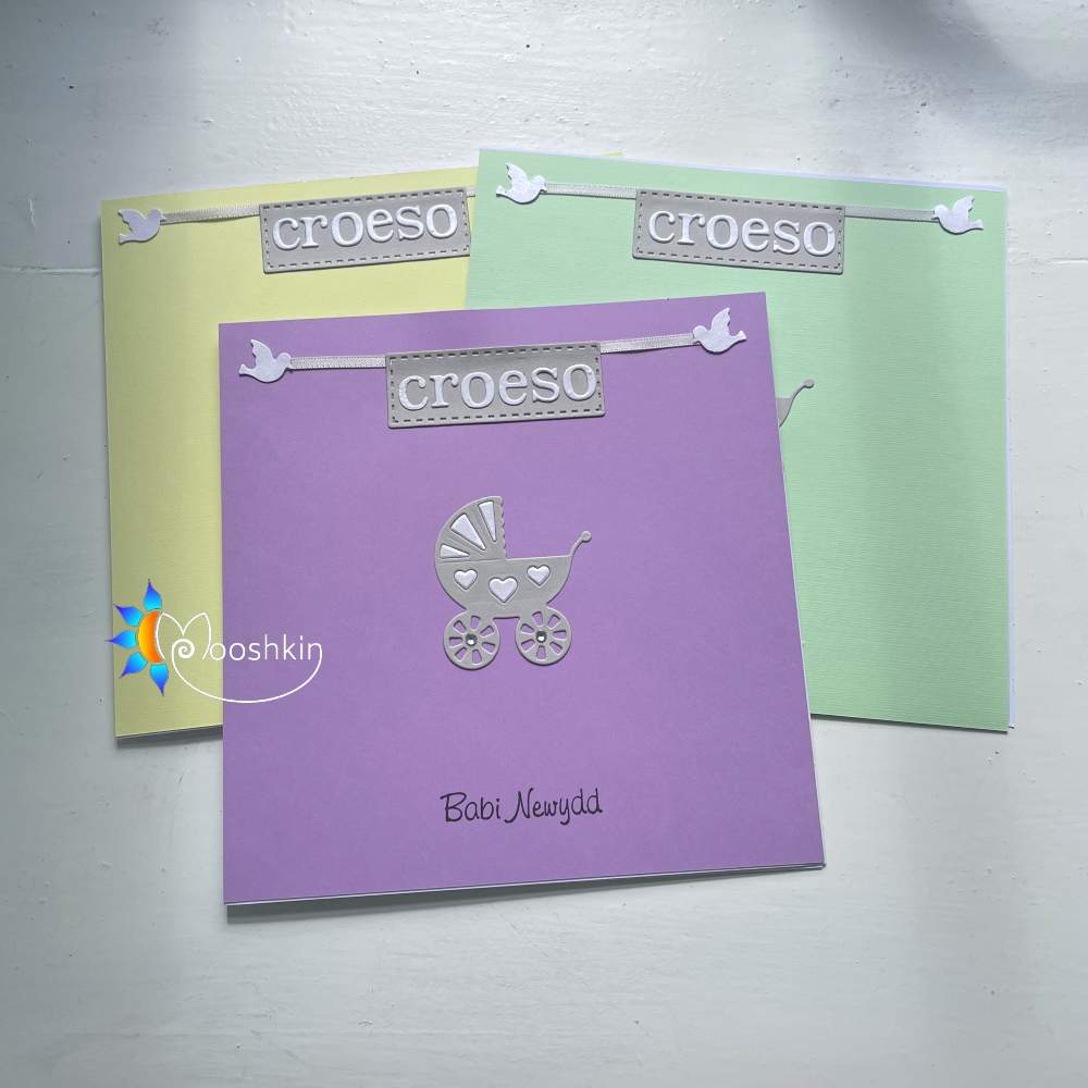 Handmade greetings card: "Die cut croeso babi newydd with pram and doves"