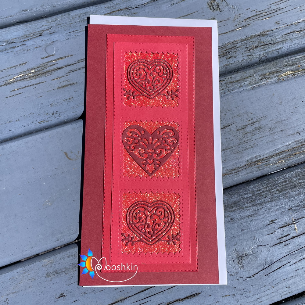 Handmade greetings card: die cut trio of fancy hearts