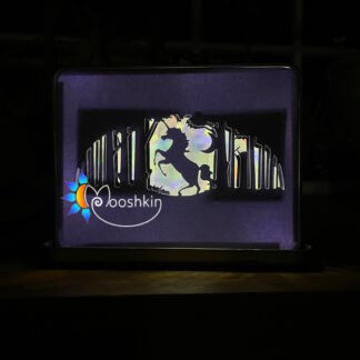 Lantin featuring a unicorn prancing in a forest, with a holographic rainbow mirror card background and warm white USB LEDs.