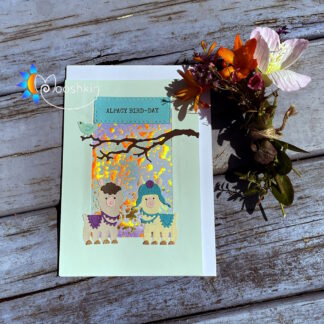 Die cut handmade greetings card featuring 2 alpacas and a bird with the greeting "alpacy bird-day"