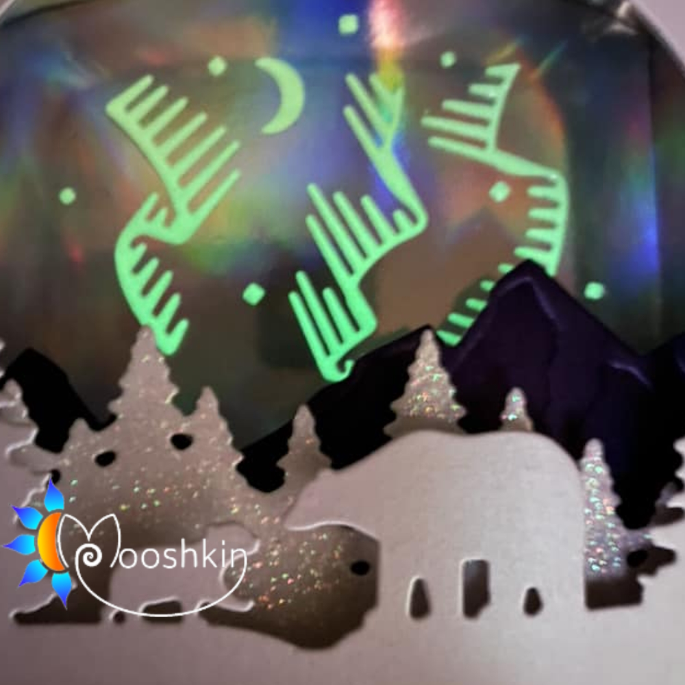 Glow-in-the-dark northern lights, moon and stars in the background of Tinter Wonderland Too