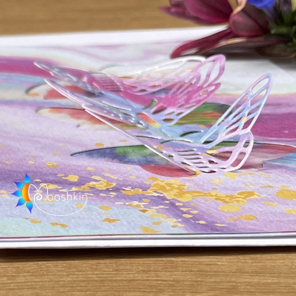 Handmade greetings card, blank for your own message. Three die-cut butterflies on very colourful cardstock.