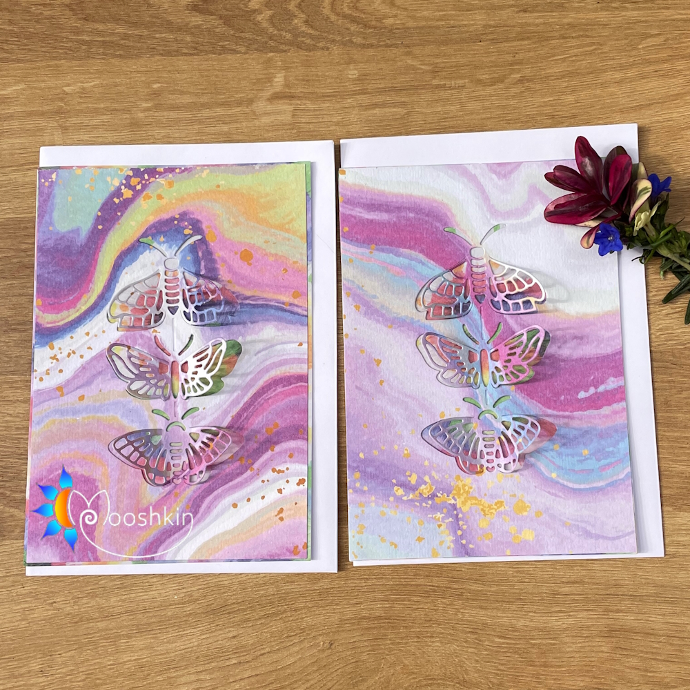Handmade greetings card, blank for your own message. Three die-cut butterflies on very colourful cardstock.