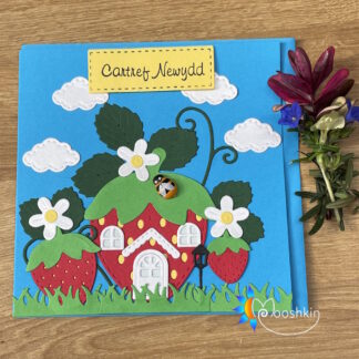Handmade greetings card - 'cartref newydd' ('new home' in Welsh) - featuring a trio of die-cut strawberries
