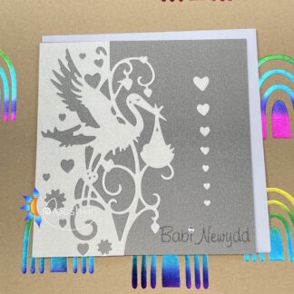 Handmade die cut greetings card featuring a stork delivering a baby