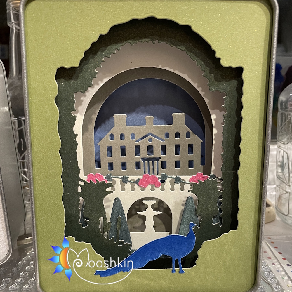 Mooshkin Lantin: 'gerddi'r plas' - handmade light-up scene in a tin featuring a manor house and formal gardens