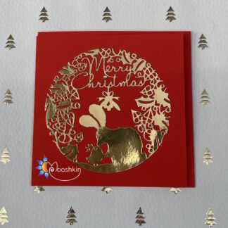 Handmade Christmas card: gold die cut of a rabbit and bird kissing under mistletoe, on a red background