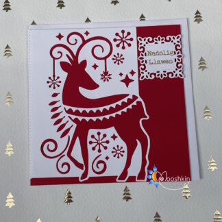 Handmade Christmas card - a Scandinavian folk art die cut of a reindeer in red and white card