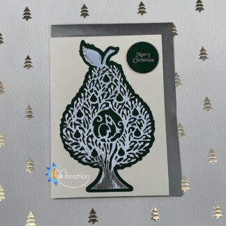 A handmade Christmas card featuring a die cut partridge in a pear tree