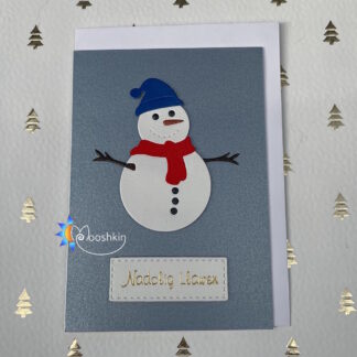 A handmade Christmas card fwaturing a die cut snowman