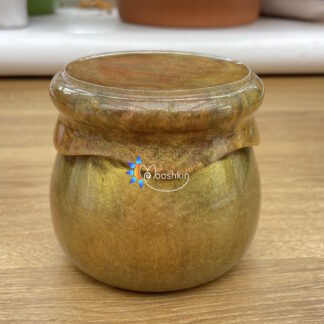 Handmade resin screw-top jar in gold with hints of red and green